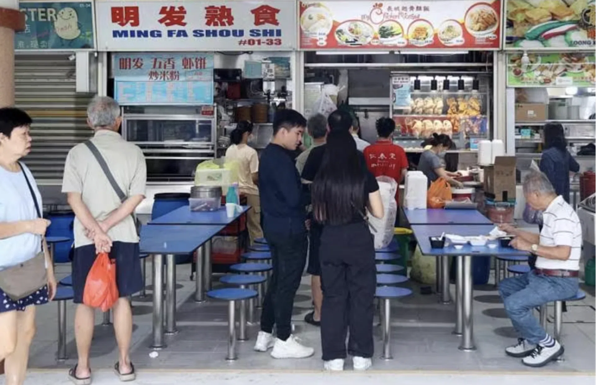 Diners find themselves sitting shoulder to shoulder at the renovated hawker centre.