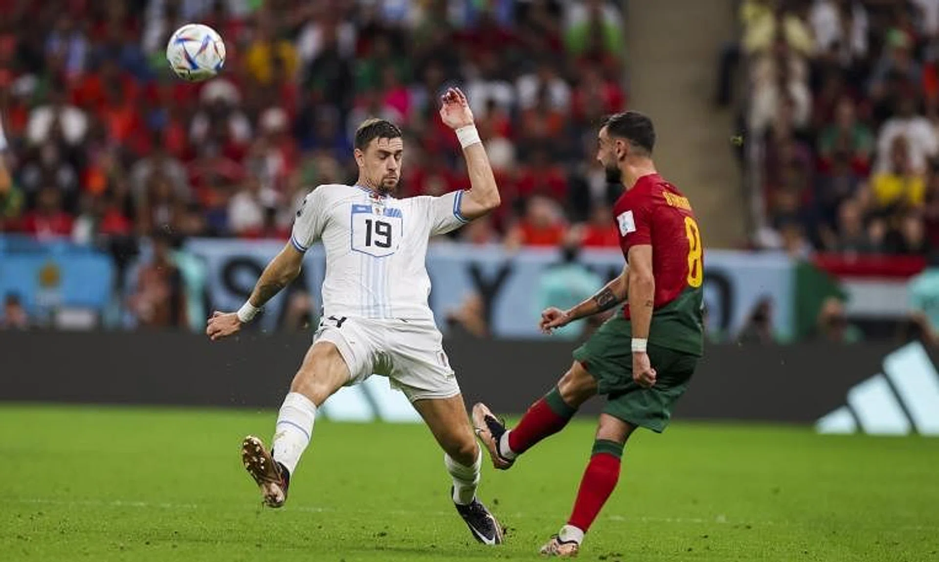 Bruno Fernandes (right) of Portugal in action against Sebastian Coates of Uruguay.