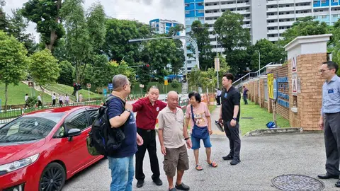 The People's Alliance for Reform's Mr Michael Fang arriving at Deyi Secondary on April 23.