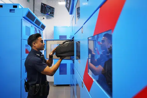 SGT Farhan Shah demonstrating withdrawing his equipment for patrol using the automated equipping system.