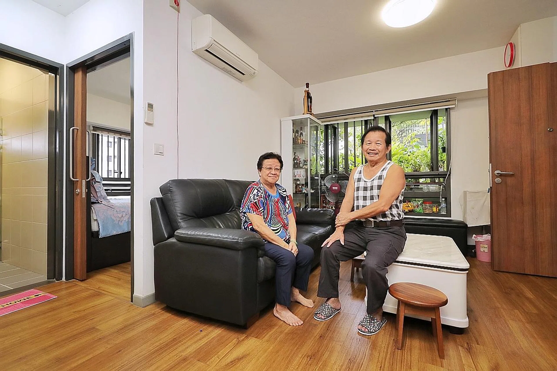 Mr Foo See Yin with his wife, Madam Low Choon Moi, in their two-room flexi unit in Kampung Admiralty, which cost about $107,000. They sold their previous home, a four-room flat in Khatib, for about $420,000 in 2017. 