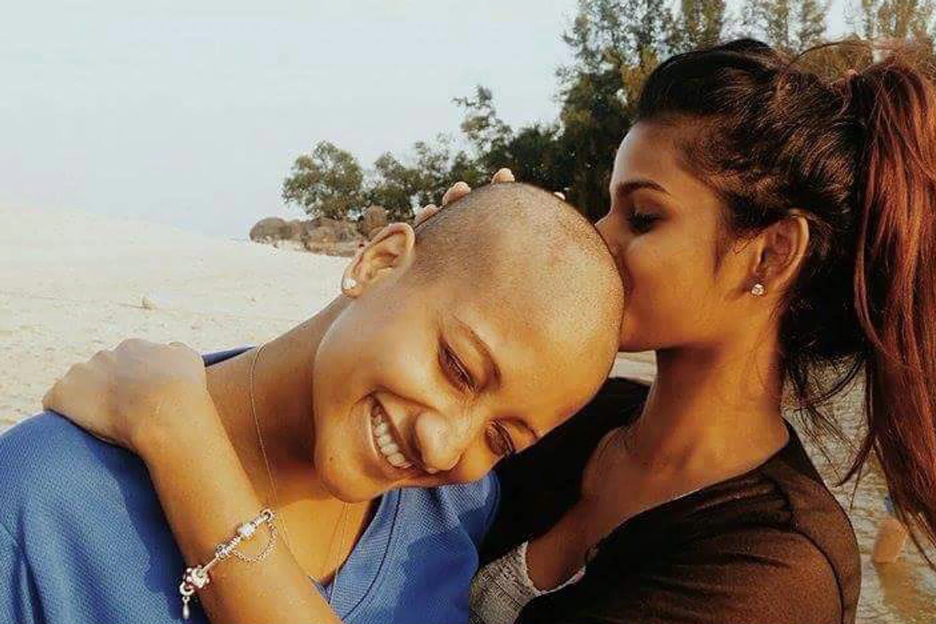 COURAGE: Vimala Velu shaved her head (above) in 2014 in support of fund-raising event Hair for Hope.