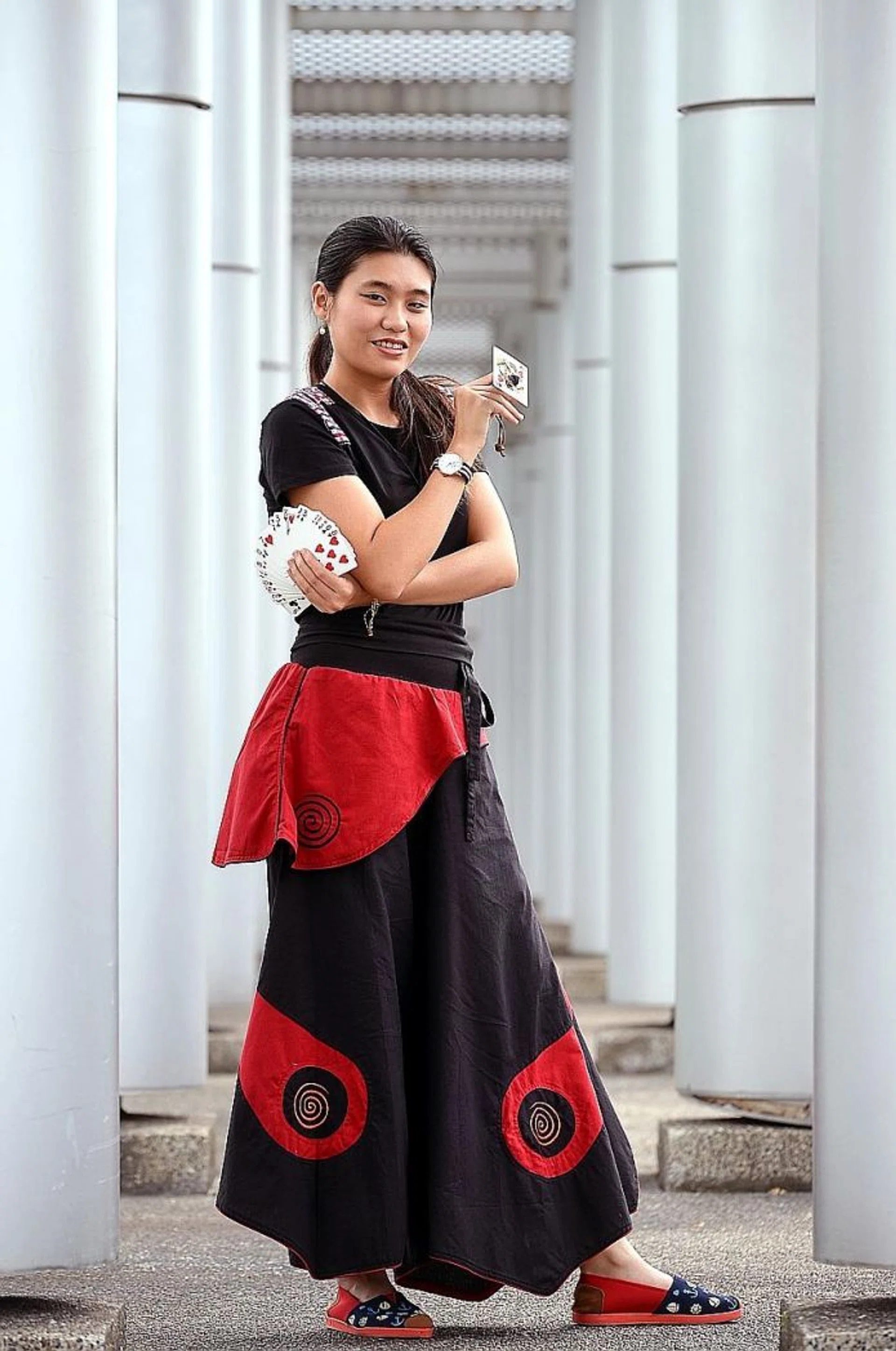 ON HER OWN: (Above) Miss Adeline Ng is, to her knowledge, the only solo professional female magician here.