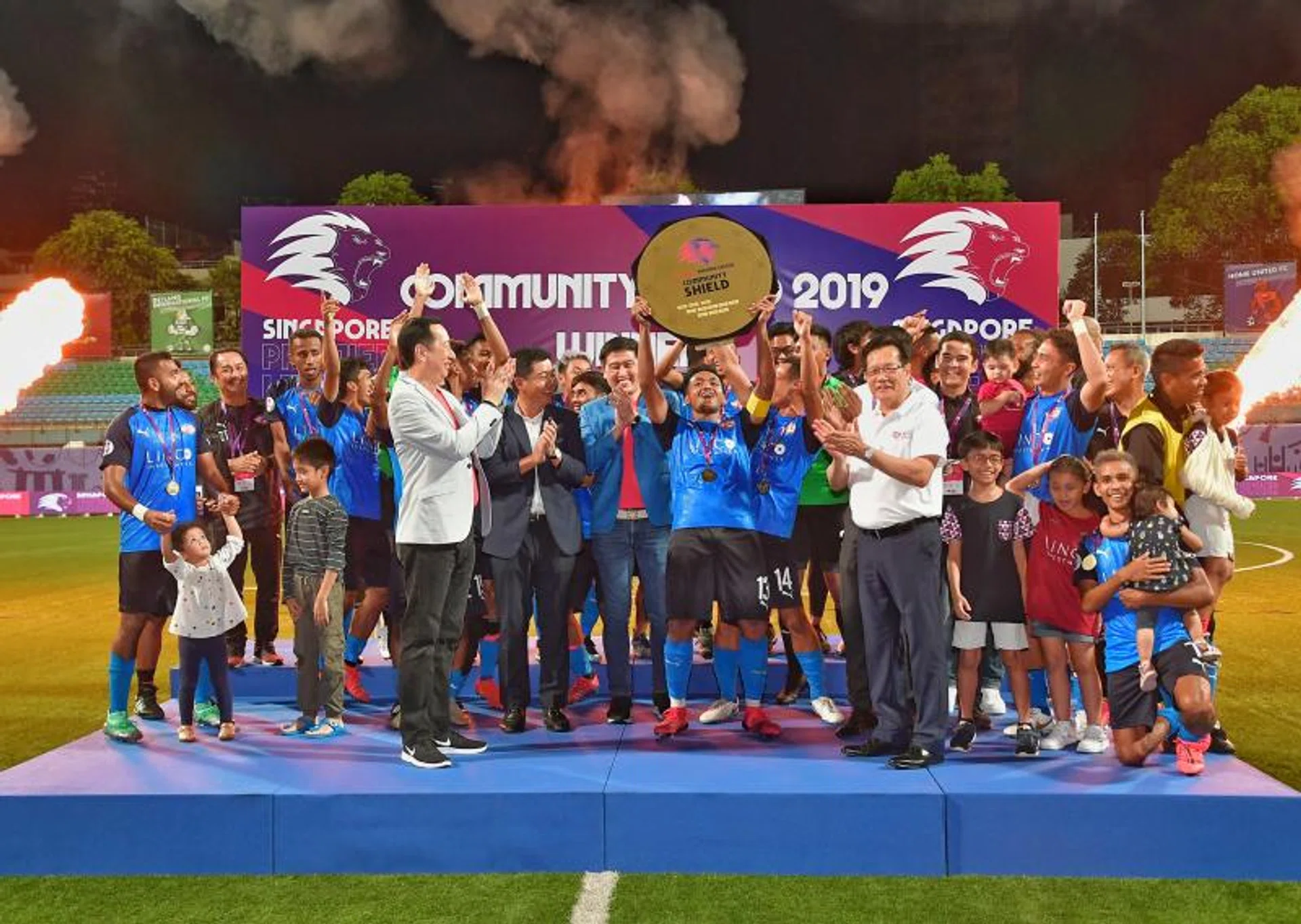 Home United skipper Izzdin Shafiq lifting the AIA Community Shield after a penalty shoot-out win over Albirex Niigata.