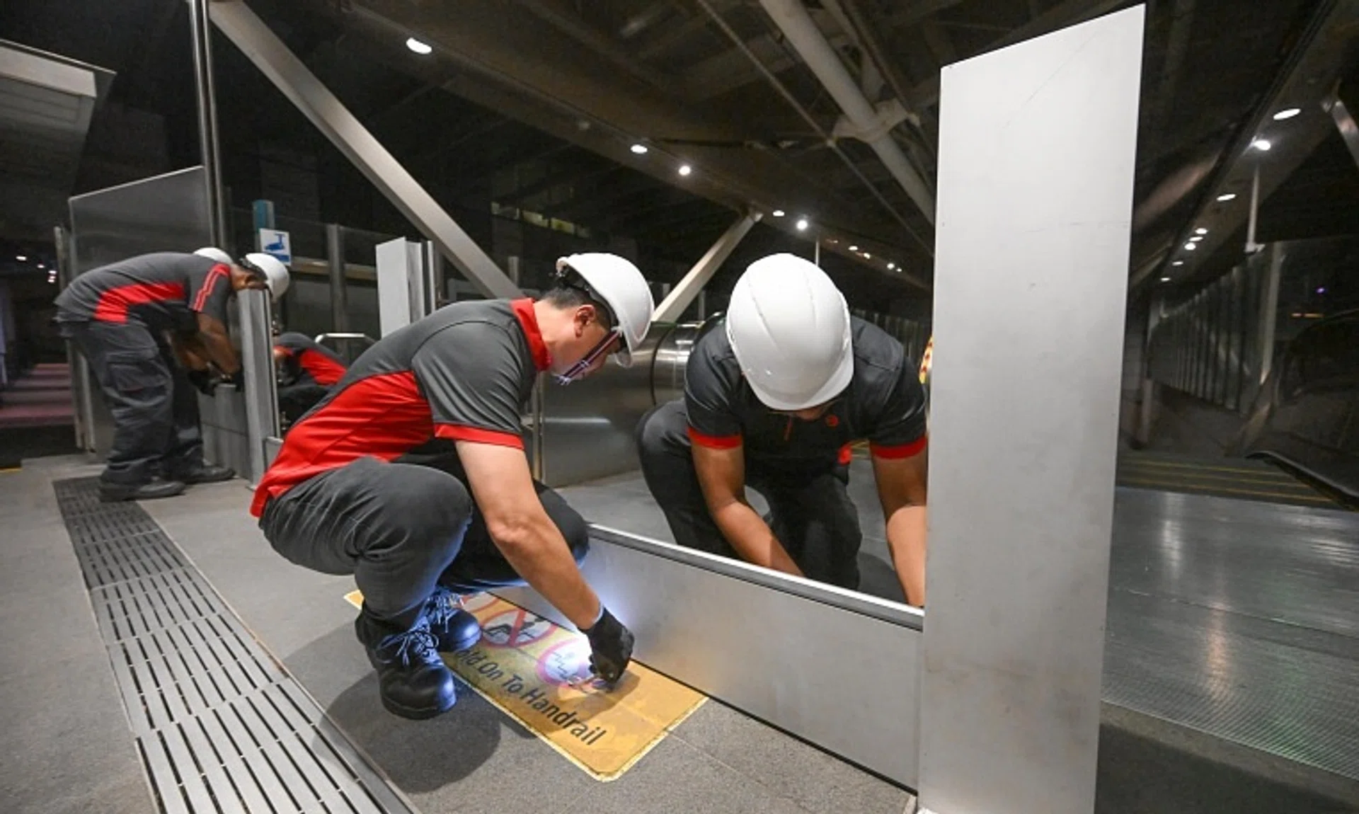 The barriers, which are in four pieces stacked one on top of the other, comprise individual metal panels and connecting columns.