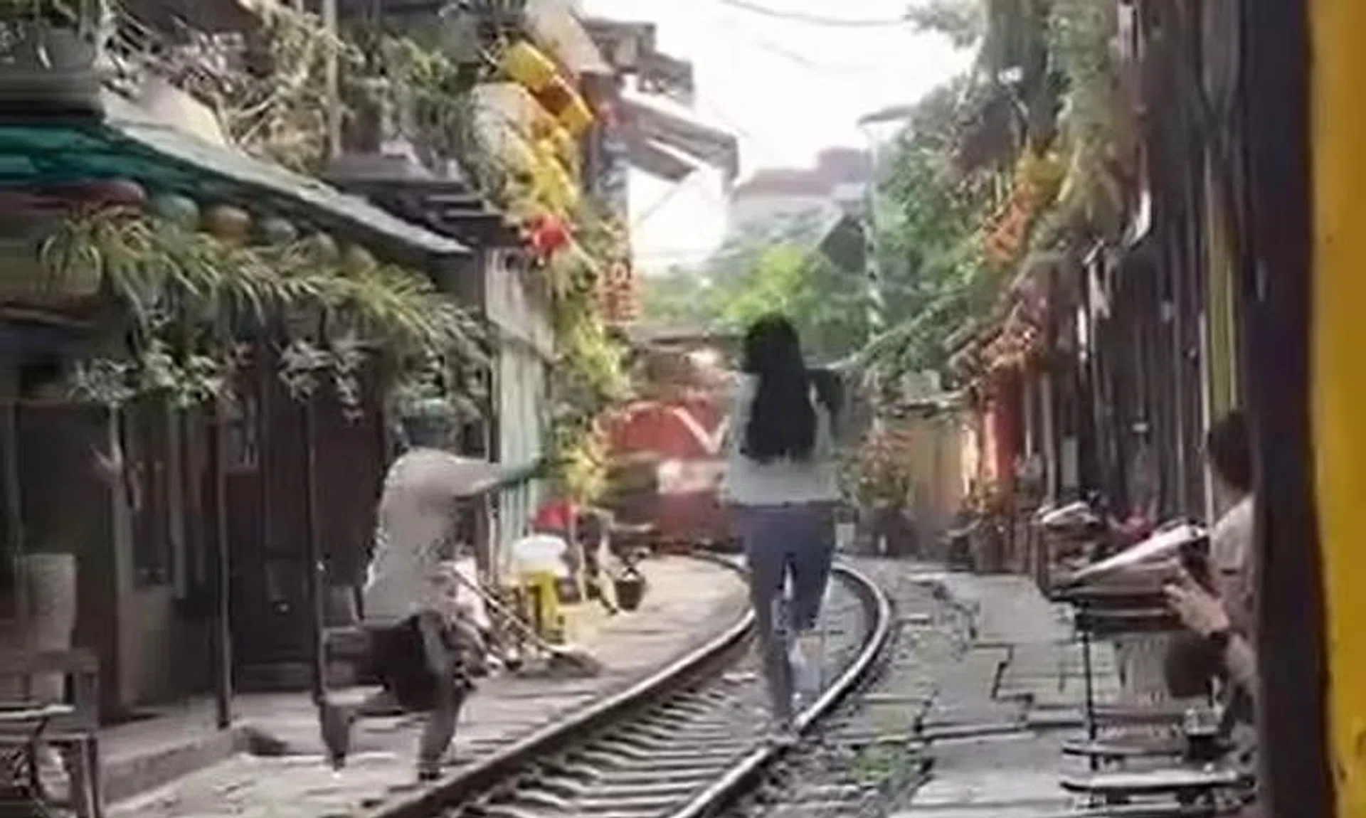 A video posted on Facebook showed a woman coming out onto the track and seemingly pose for a photo as the train approached.