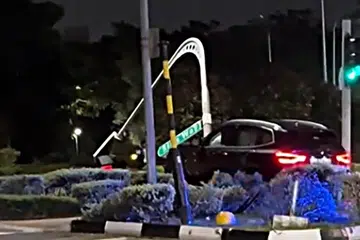 BMW driver who crashed into traffic light arrested for drink driving