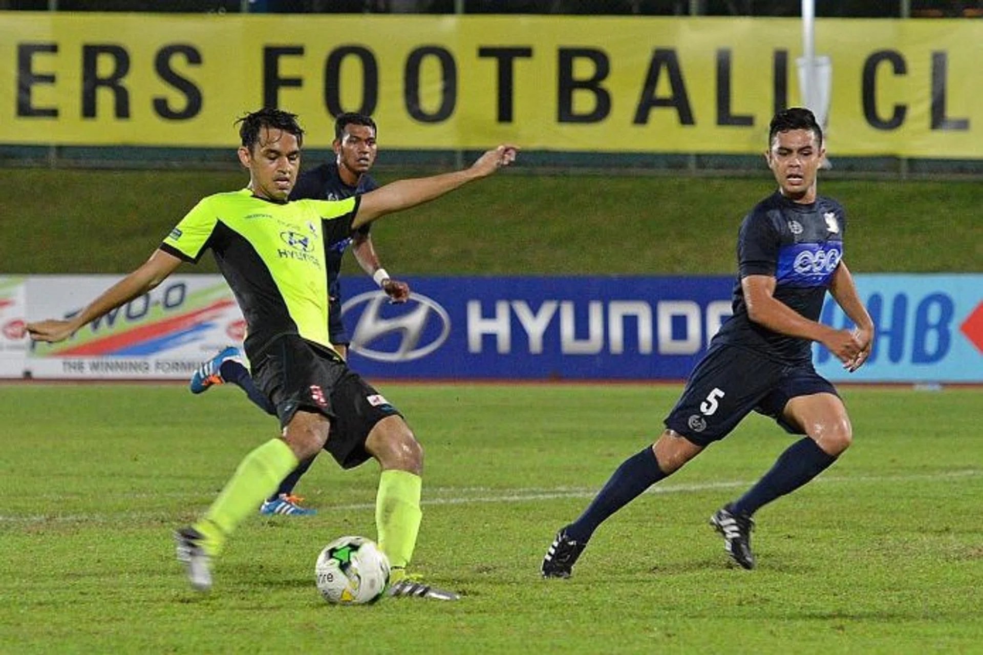 INJURY HELL: On his return from a broken foot against Hougang United (in blue) in July, Tampines Rovers' Shahdan Sulaiman (left) suffered another foot injury.  