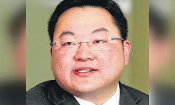 Malaysian fugitive Jho Low and father sentenced to jail for contempt of court