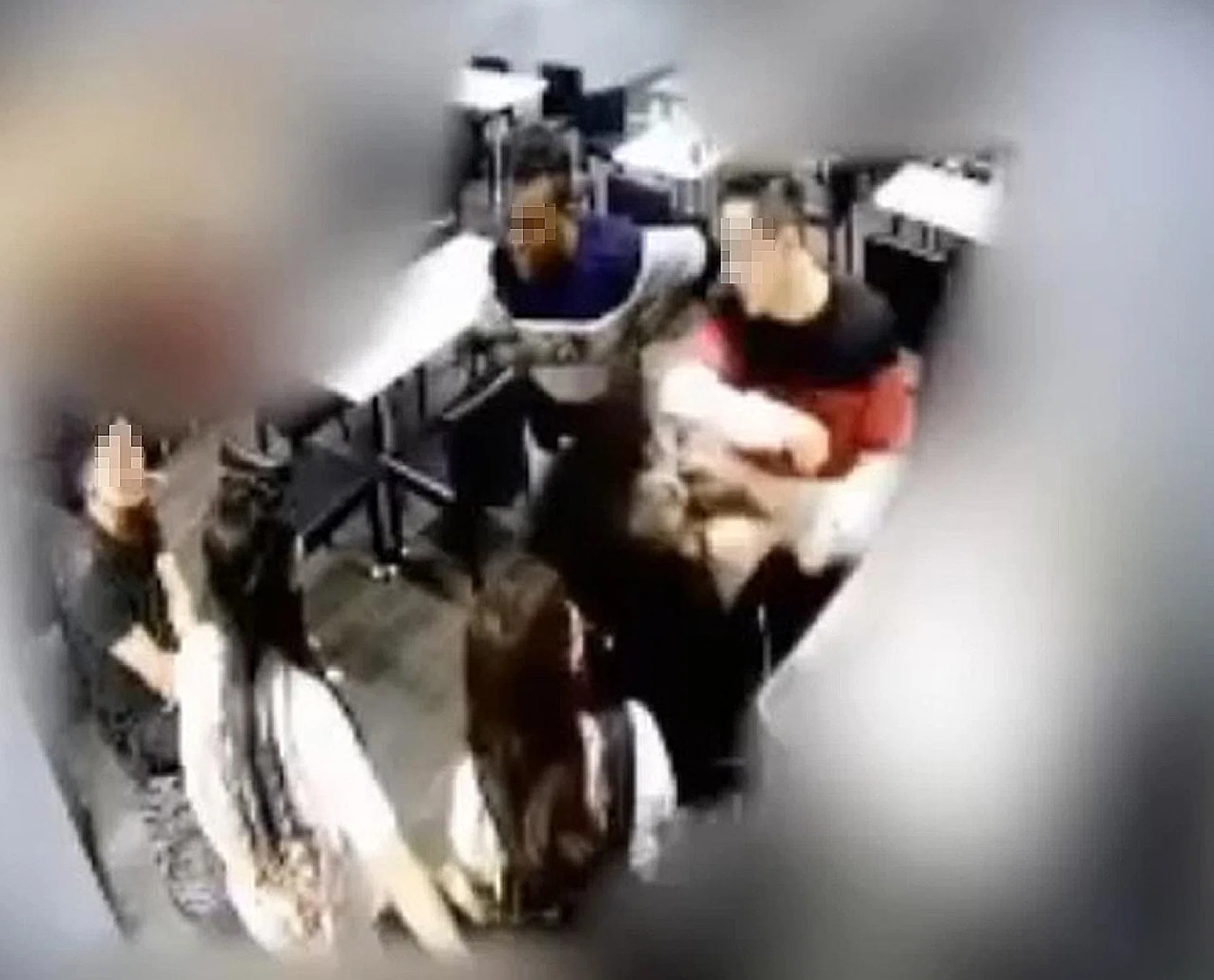 A screen shot of the video where the man is seen apparently elbowing the woman in the face. 