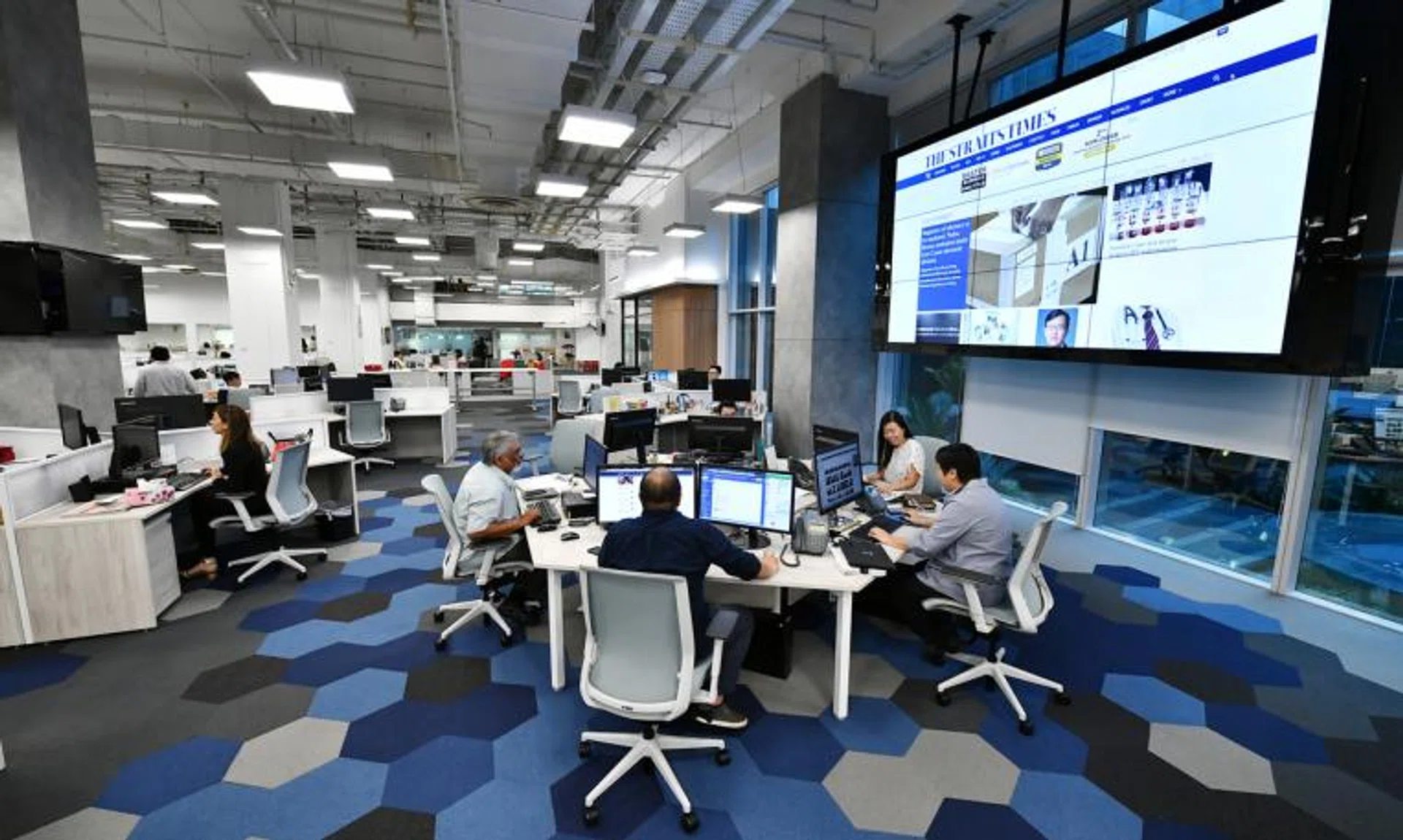 Mr Paul Jacob (second from left) at ST newsroom’s central hub, where the key editors of all the sections are stationed, on Feb 1, 2019.