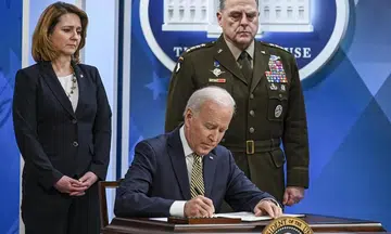 Biden brands Putin 'a war criminal'