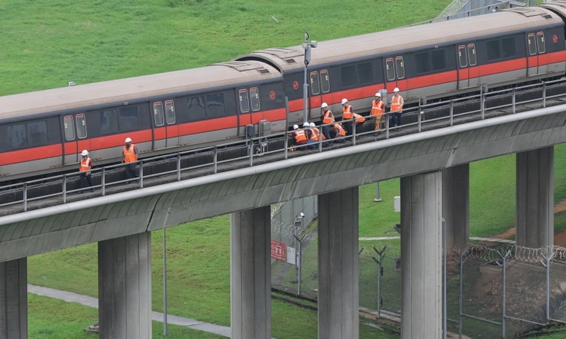 SMRT staff inspecting the carriages of the affected train outside Ulu Pandan Depot at about 1.45pm on Sept 25.