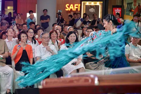 DPM Gan Kim Yong, flanked by South West District Mayor Low Yen Ling (in orange) and North East CDC vice-chairman Yeo Wan Ling, watching a flamenco performance at Safra Choa Chu Kang on March 30. Seated behind them are (from left) PAP new faces Chua Wei-Shan and Choo Pei Ling.