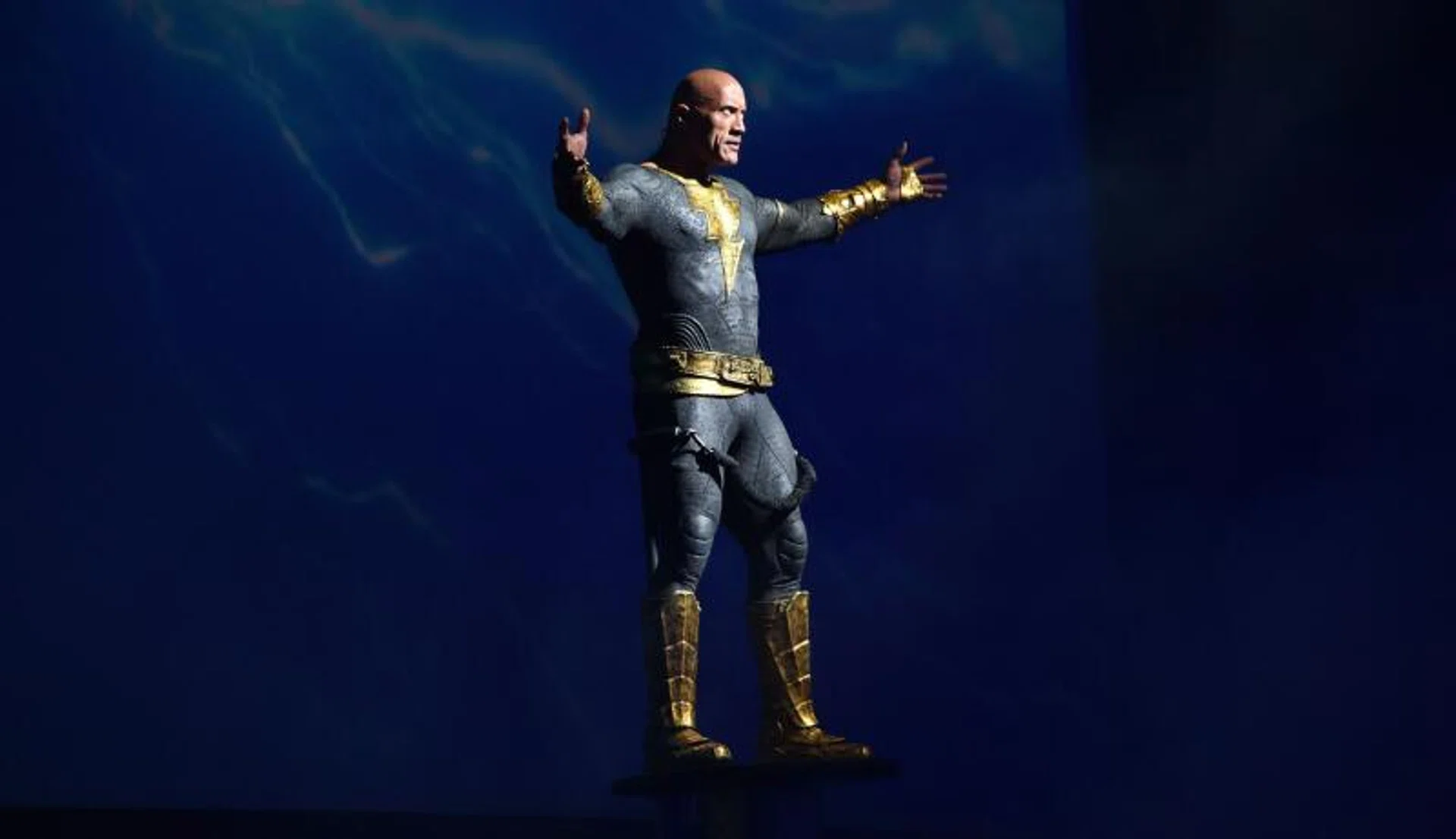 Dwayne Johnson arrives on stage to present his film Black Adam during the Warner Bros. panel at Comic-Con in San Diego on July 23, 2022.