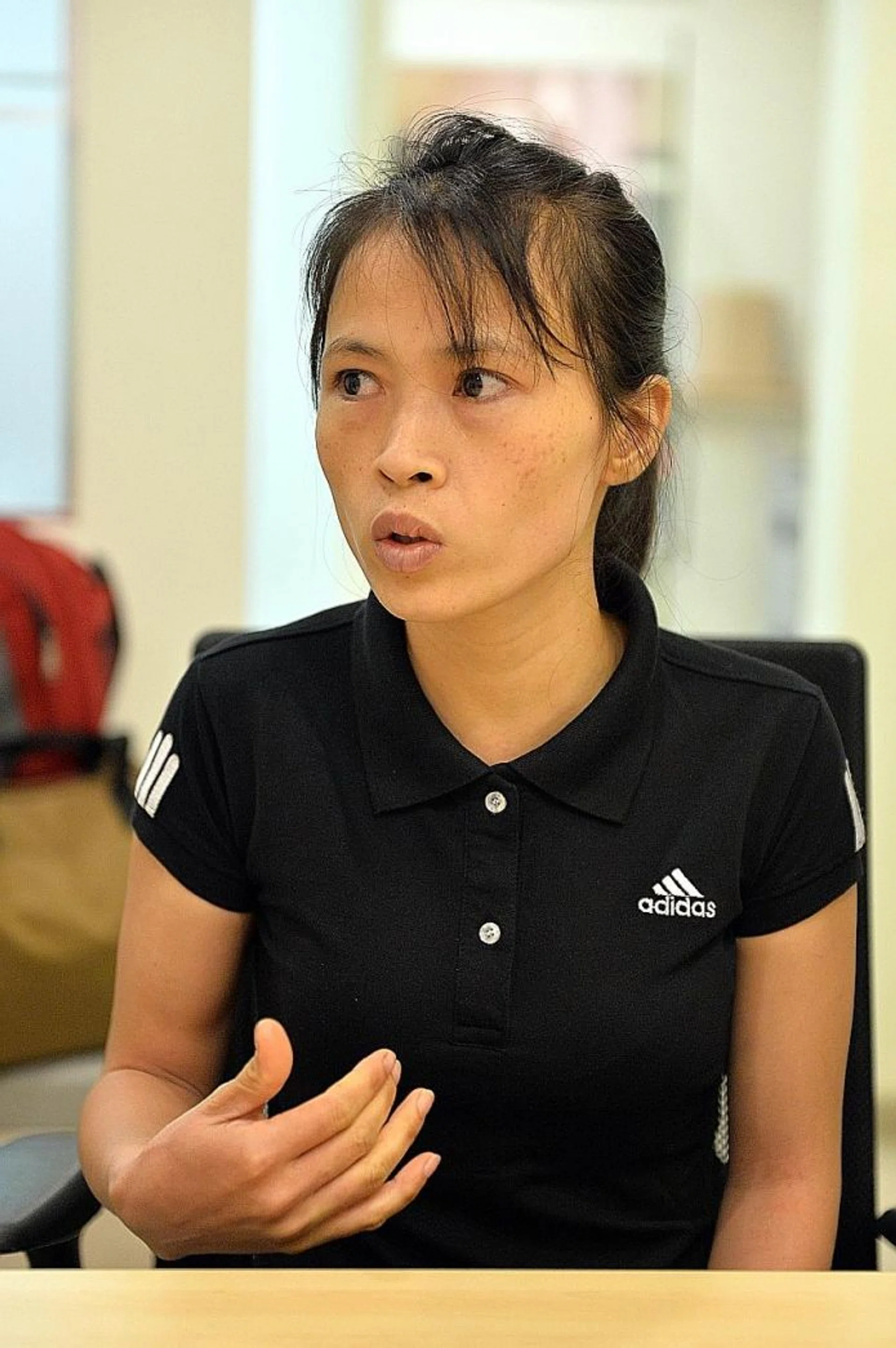IN DEBT: Madam Bui Thi Thu Ha said her husband borrowed about US$8,000 (S$11,000) to pay the agent, travel and administrative fees to work in Singapore.