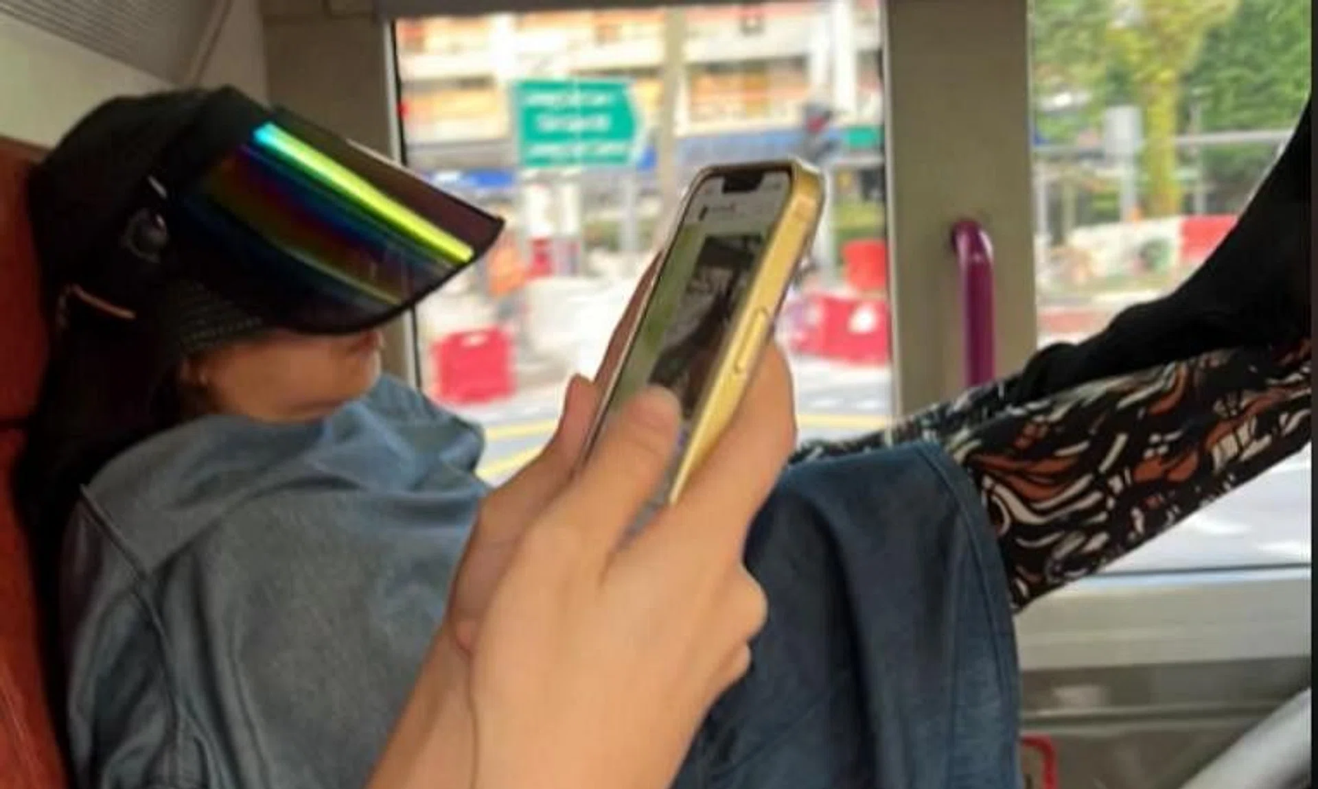 In a video on TikTok, the woman is seen resting her feet on the seat in front of her, as well as against a pole in the bus. 