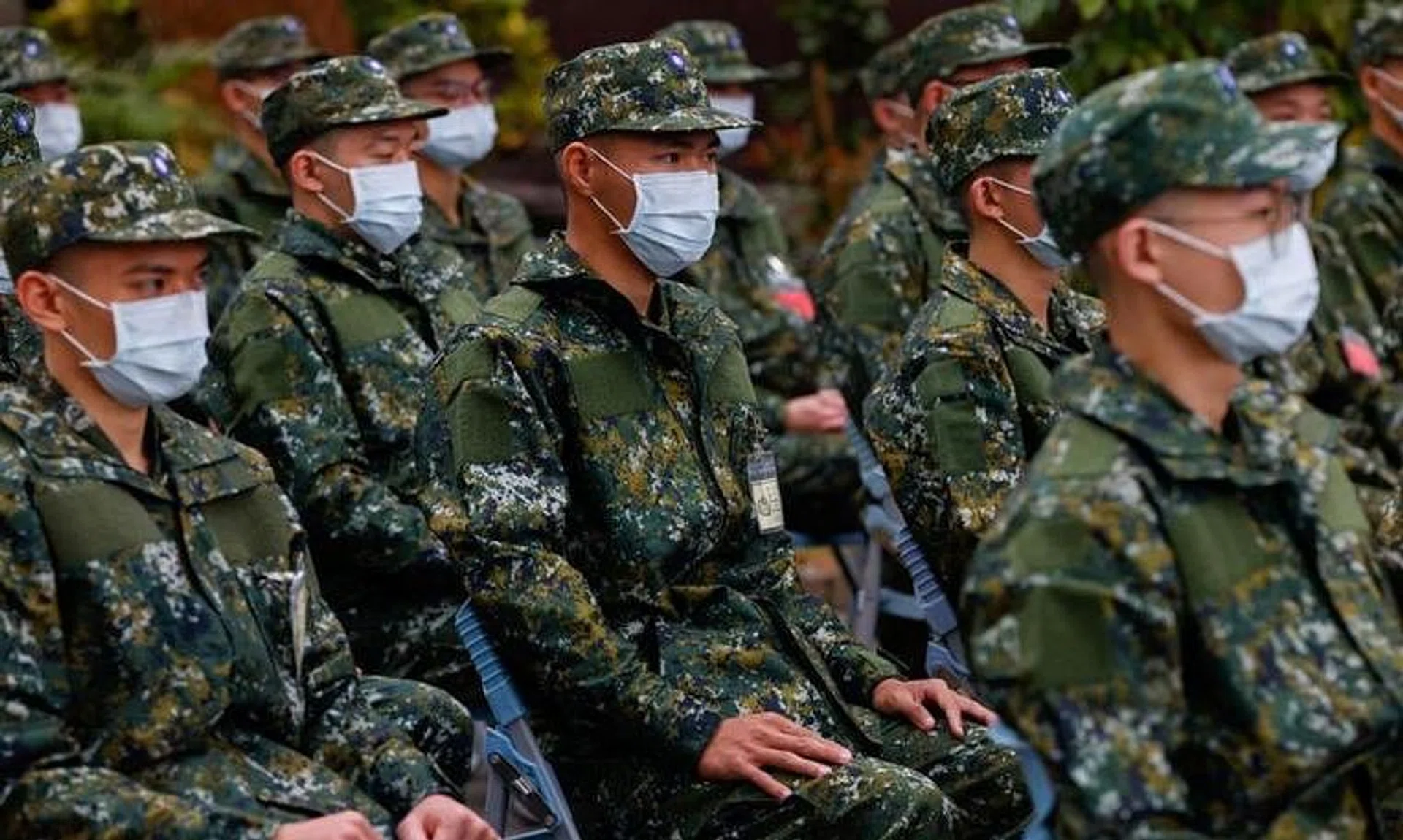 The first batch of new recruits listens to instructions as they set to begin one-year compulsory military service in Taiwan.