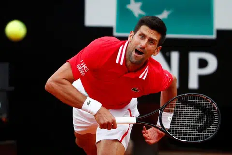 Djokovic expected to defend French Open title with virus rules eased