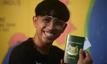 'I am not an alien any longer': Stateless youth becomes S'pore PR