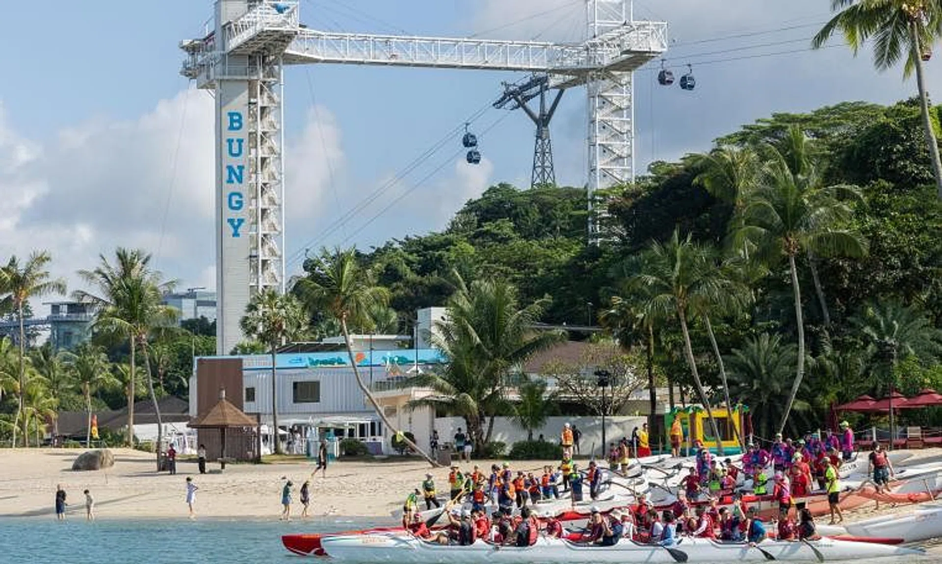 Various paddler and canoe groups participating in the re-opening of Siloso Beach on Aug 3.