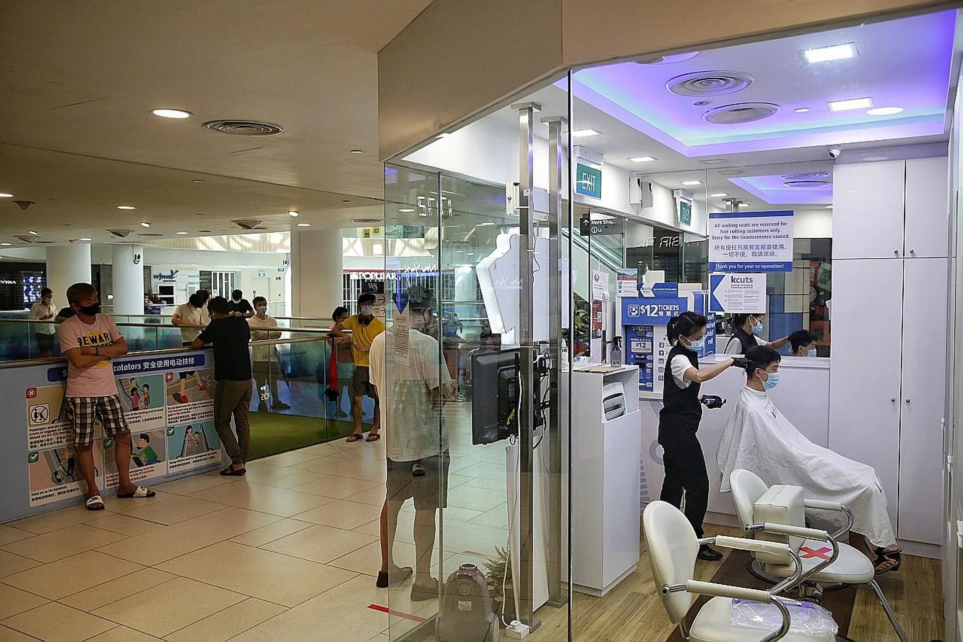 Patrons outside the kcuts outlet at White Sands mall yesterday. The task force has yet to announce what businesses will be allowed to open next month.