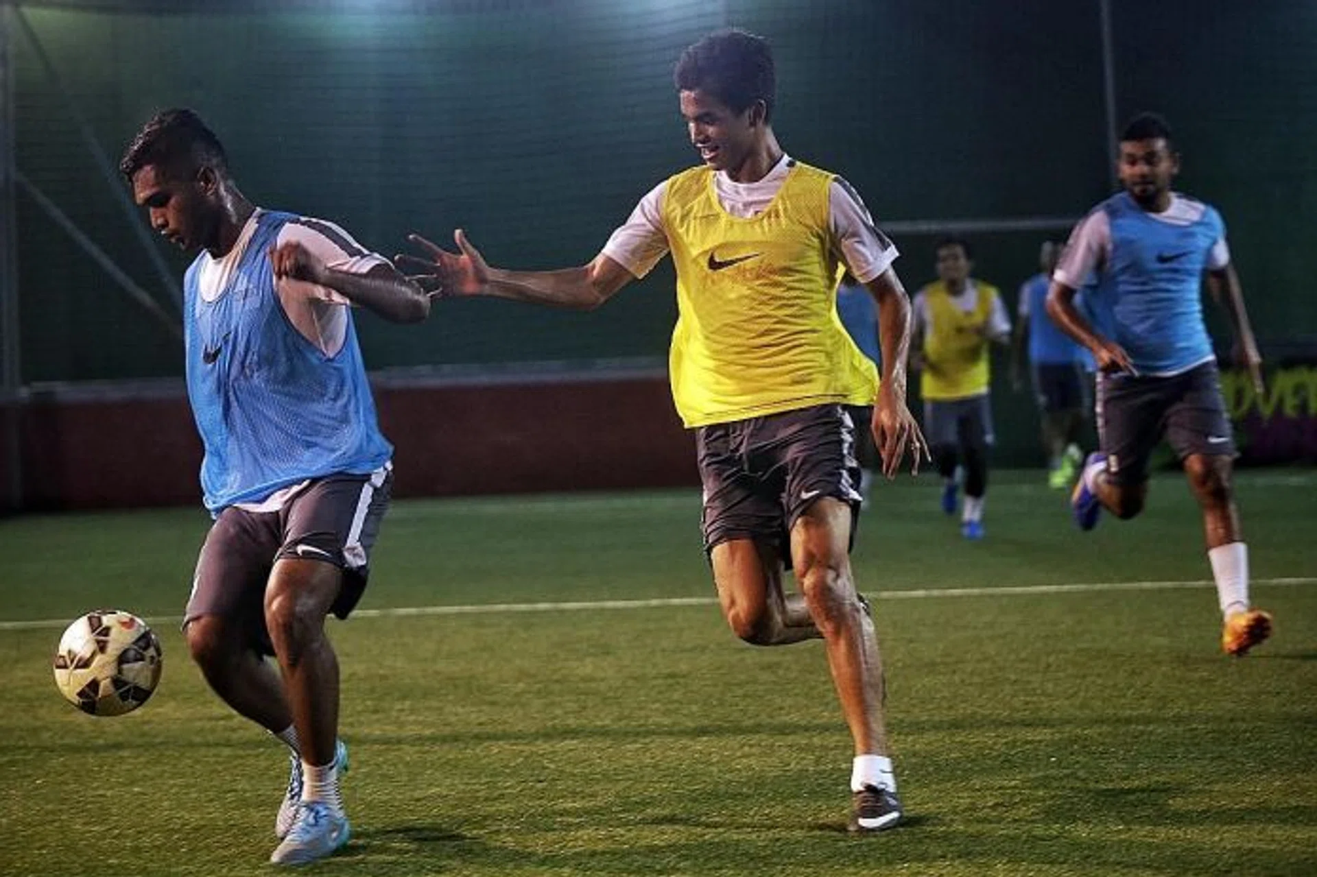 LIONS IN ACTION: National team stars Hariss Harun (left) and Safuwan Baharudin tussle for the ball.