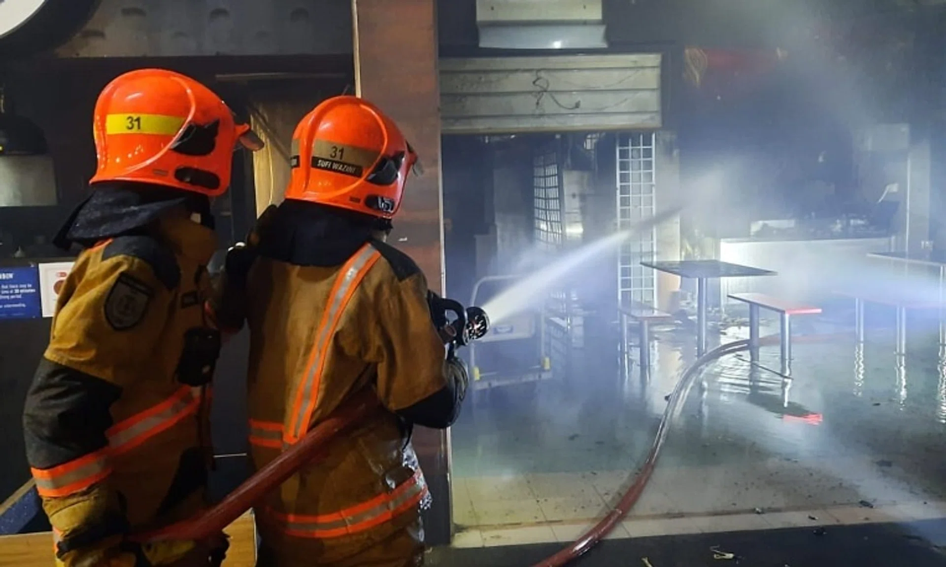 About 100 people were evacuated after a fire broke out at a coffee shop at Block 717 Yishun Street 71 on Sept 18.