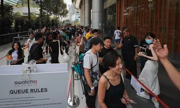 Snaking queue outside Ion Orchard on launch of Snoopy-themed MoonSwatch