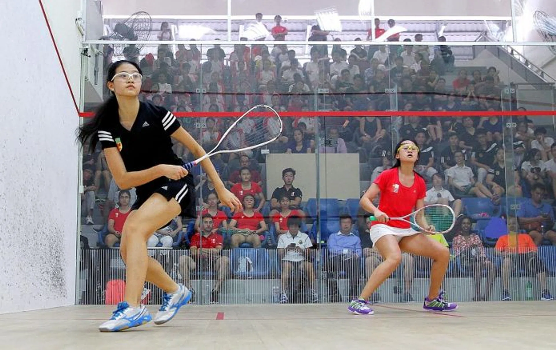 CALM AND COMPOSED: RI's Annabelle Lim (above left) dished out an assured performance against her NJC counterpart Lee Ying Xi to seal first place for her team. 
