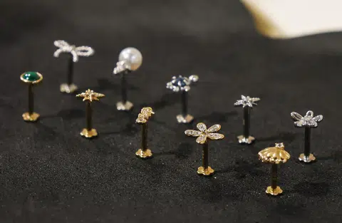 J&Co's 14K solid gold flatback earrings in yellow and white gold.