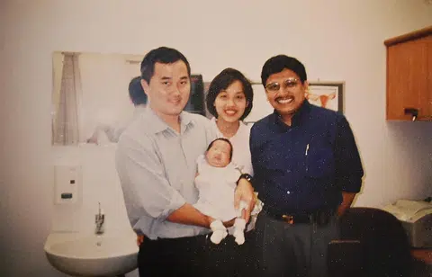 Baby Karuna with her father Lee Eng Chuan (left), mother Magdaline Tan and Professor Arijit Biswas.