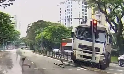 Garbage truck loses control in Havelock area, toppling traffic light and almost hitting pedestrian