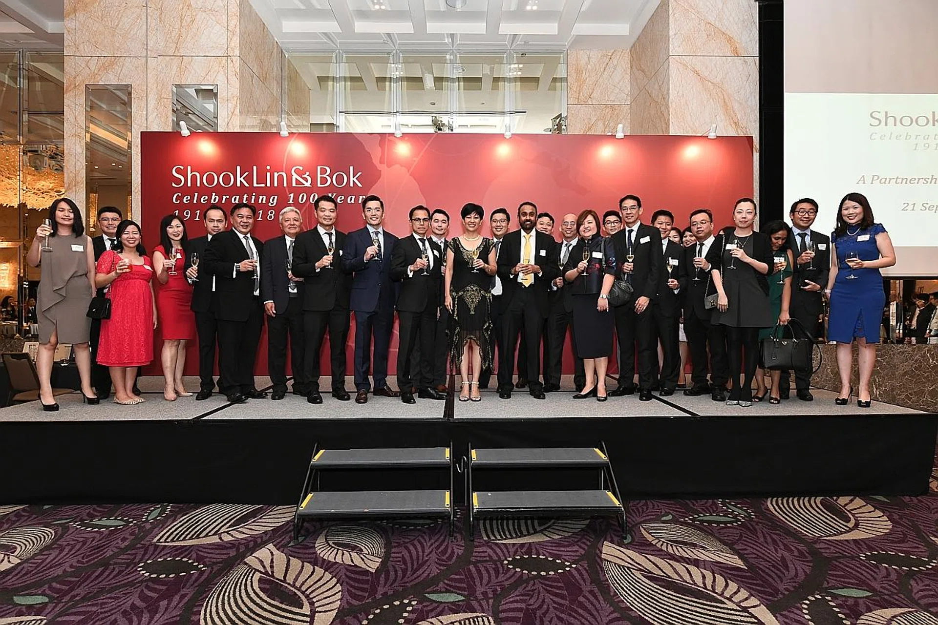 Minister in the Prime Minister's Office Indranee Rajah (centre, in black dress) at a reception celebrating law firm Shook Lin & Bok's centenary last Friday.