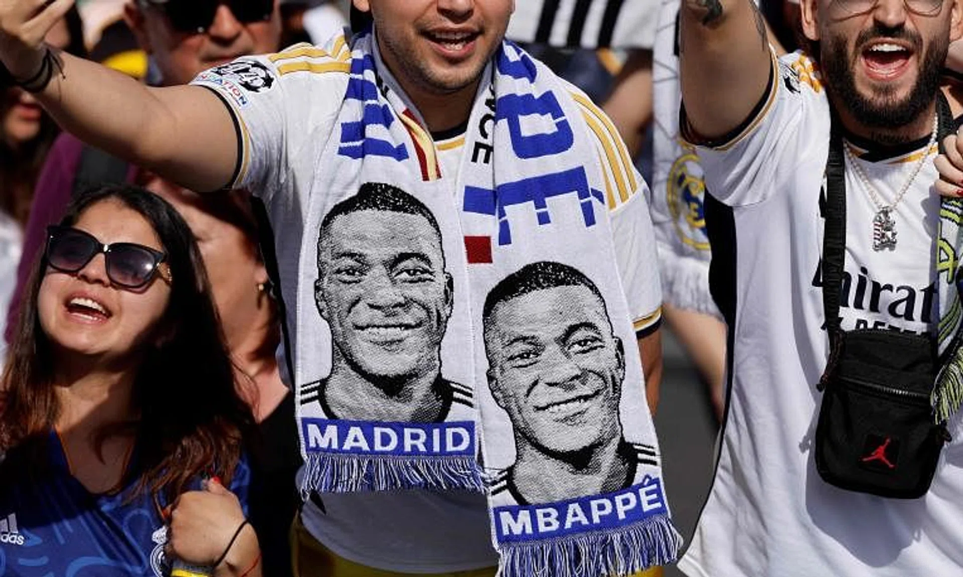 A Real Madrid fan with football scarf depicting French footballer Kylian Mbappe in Madrid on May 12. Mbappe signed for Real on June 3.