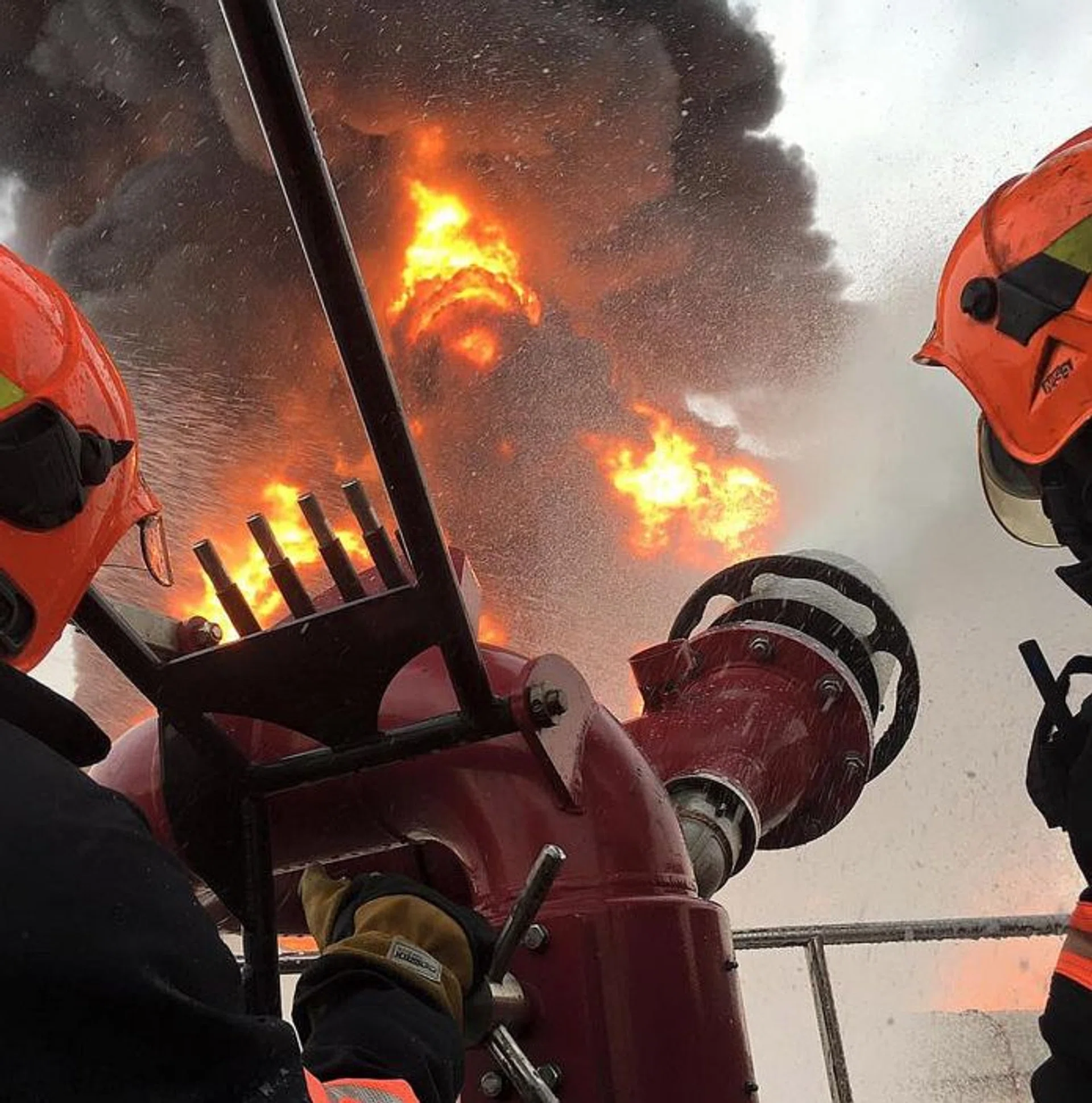 EFFICIENT: (Above) The large foam monitor used to mitigate the fire can shoot out 27,000 litres of foam per minute. 