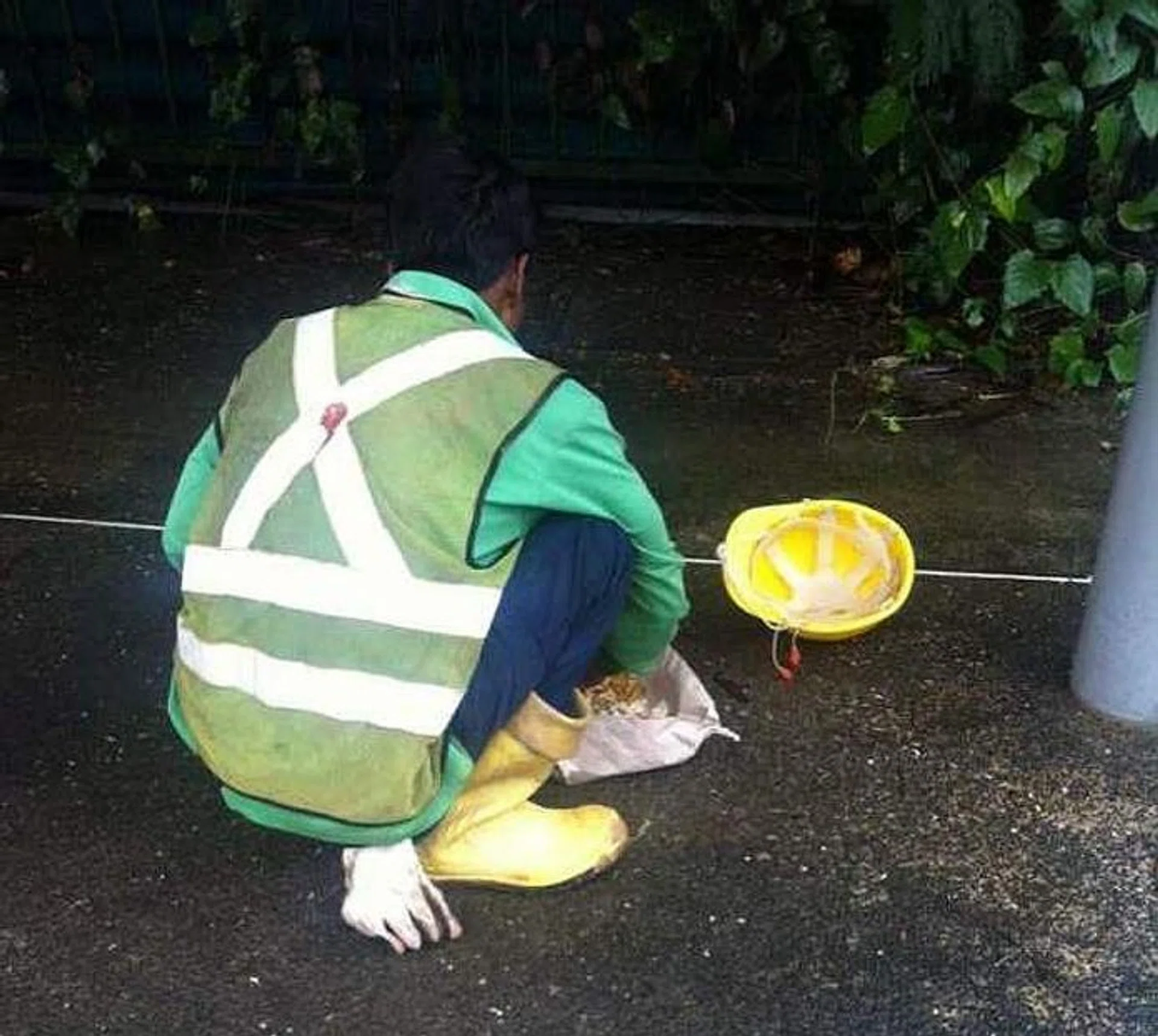 HIS REASON: The netizen who sent this picture to Stomp said that when he asked the foreign worker why he was eating on the floor, the worker said he did not want to dirty the nearby bench.