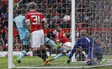 Martial salvages draw for Man United