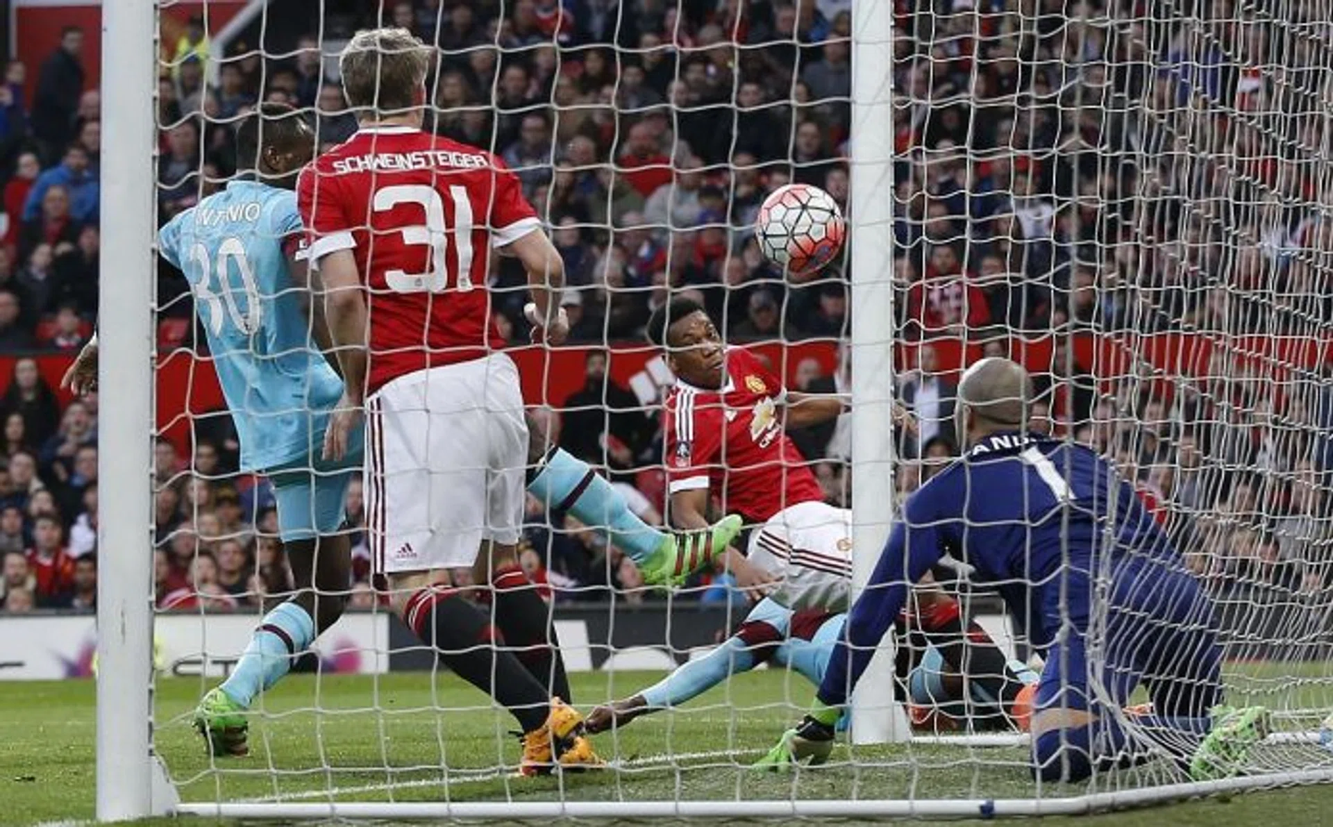 STAYING ALIVE: Anthony Martial (second from right) cancelling out Dimitri Payet's superb free-kick.  