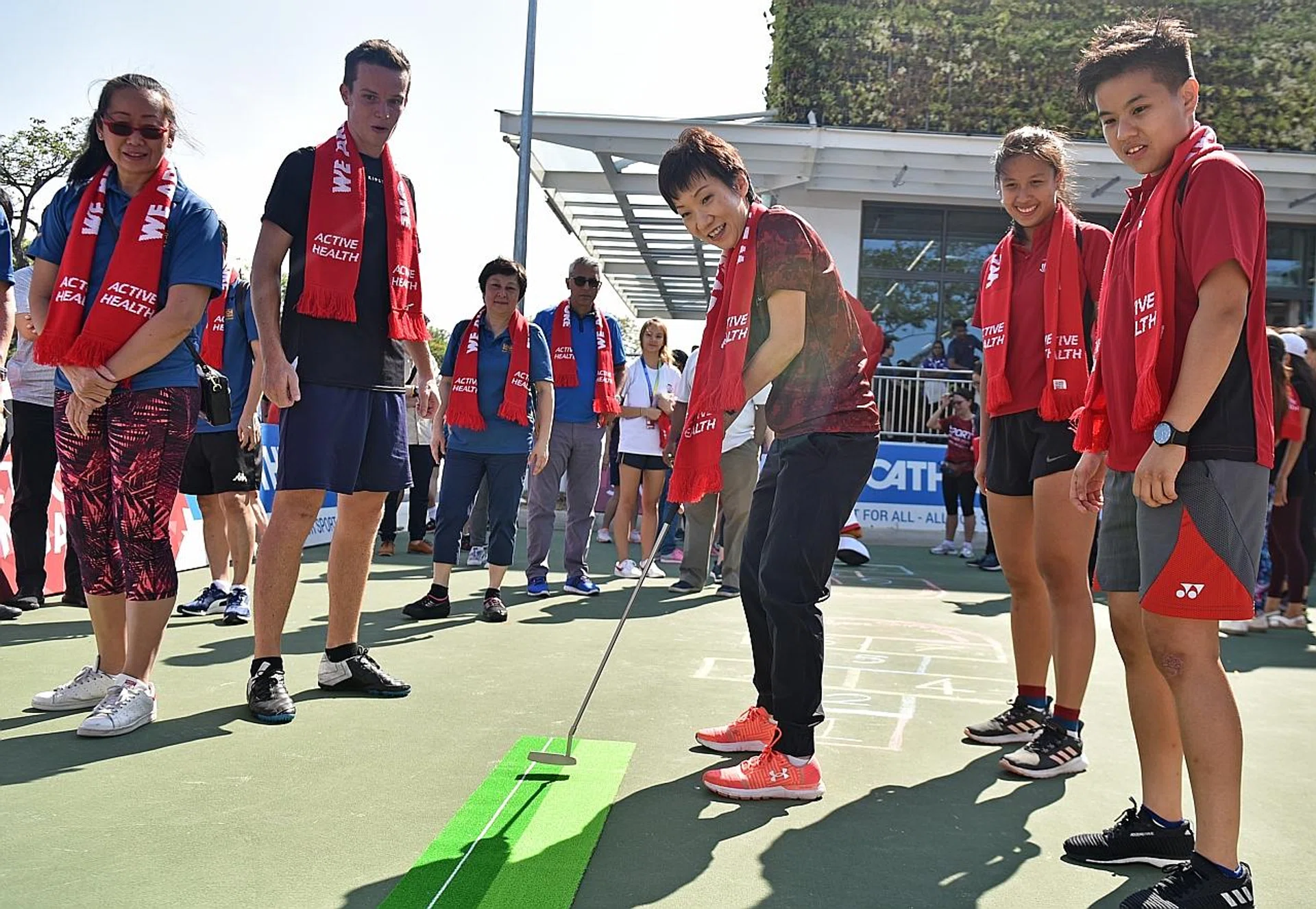 Guest of honour Grace Fu, Minister for Culture, Community and Youth, taking part in a sports day yesterday at Decathlon Singapore Lab in Kallang. TNP PHOTO: JOSEPH CHUA