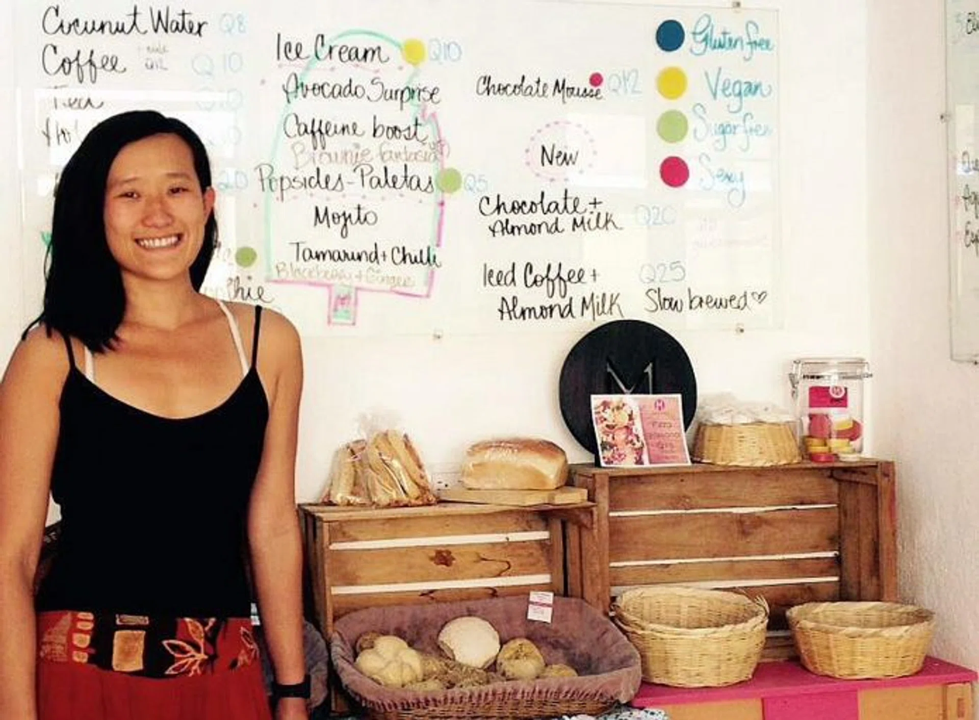 A TASTE FOR HELPING OTHERS: Miss Denise Lim in her bakery (left) and restaurant (above).