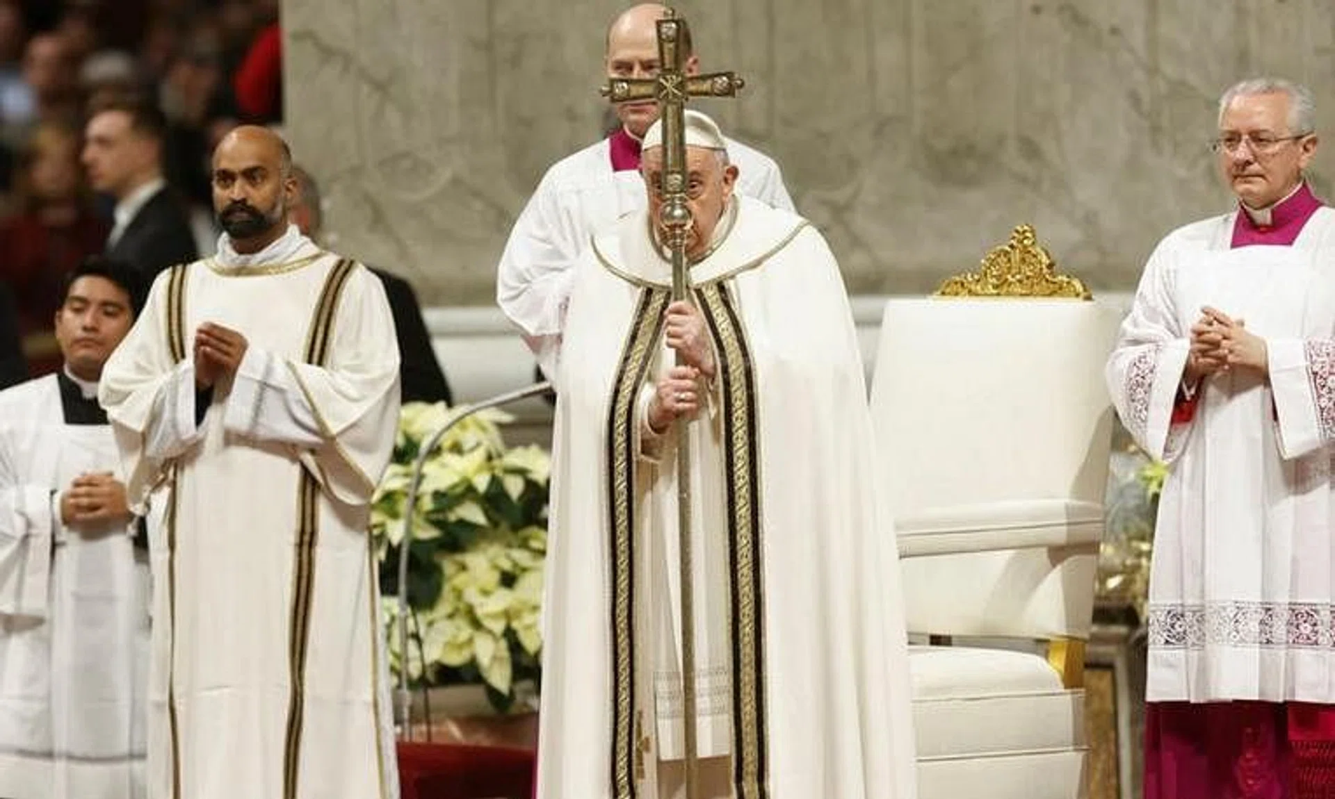 Pope Francis presided at a solemn Christmas Eve Mass in St. Peter's Basilica and spoke of the conflict in the Holy Land in his homily.