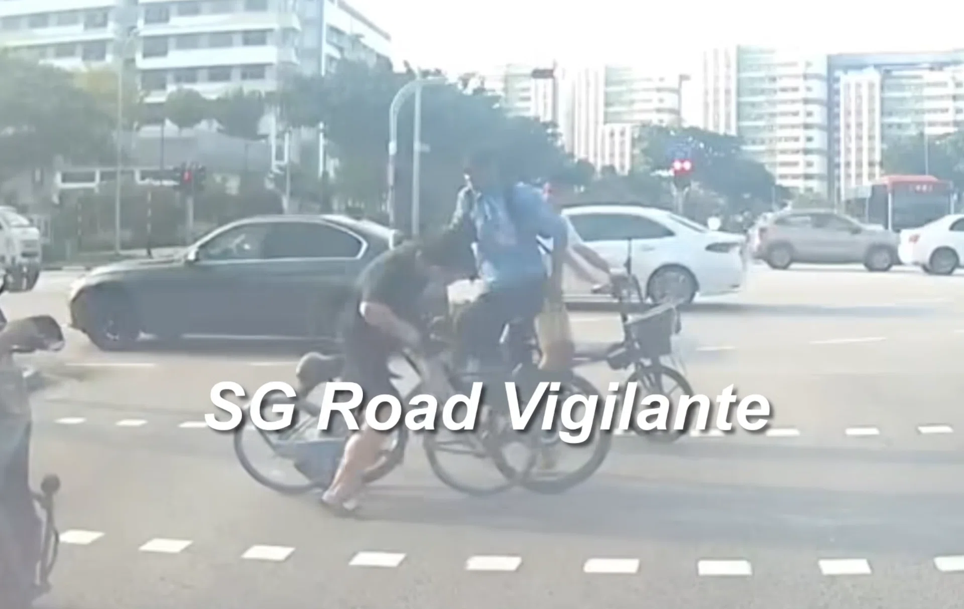 The cyclist slapped the oncoming cyclist, who was fumbling with his own bicycle.