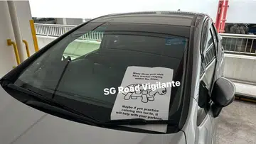 Poorly-parked car given colouring exercise to help driver learn to stay within the lines