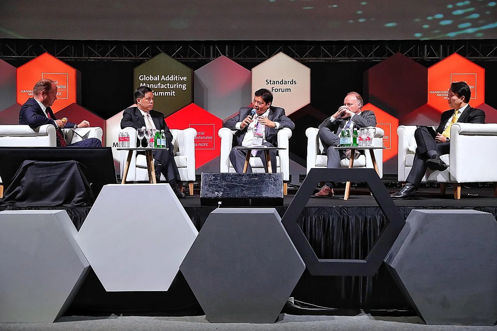(From left) Minister for Trade and Industry Chan Chun Sing, Indonesia's Minister of Industry Airlangga Hartarto and Pepperl + Fuchs' Dr Gunther Kegel during a plenary discussion at the Industrial Transformation Asia-Pacific trade fair. 