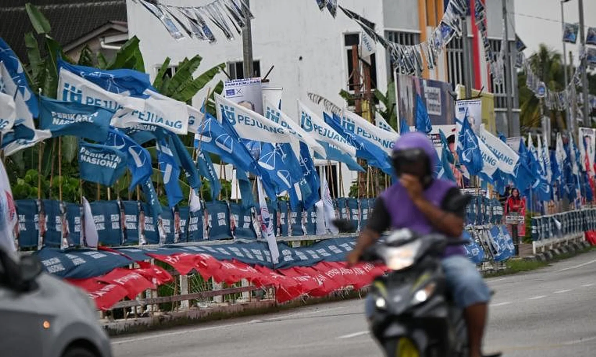 Party flags lining the streets of Tapah in Perak, on Nov 14, 2022.