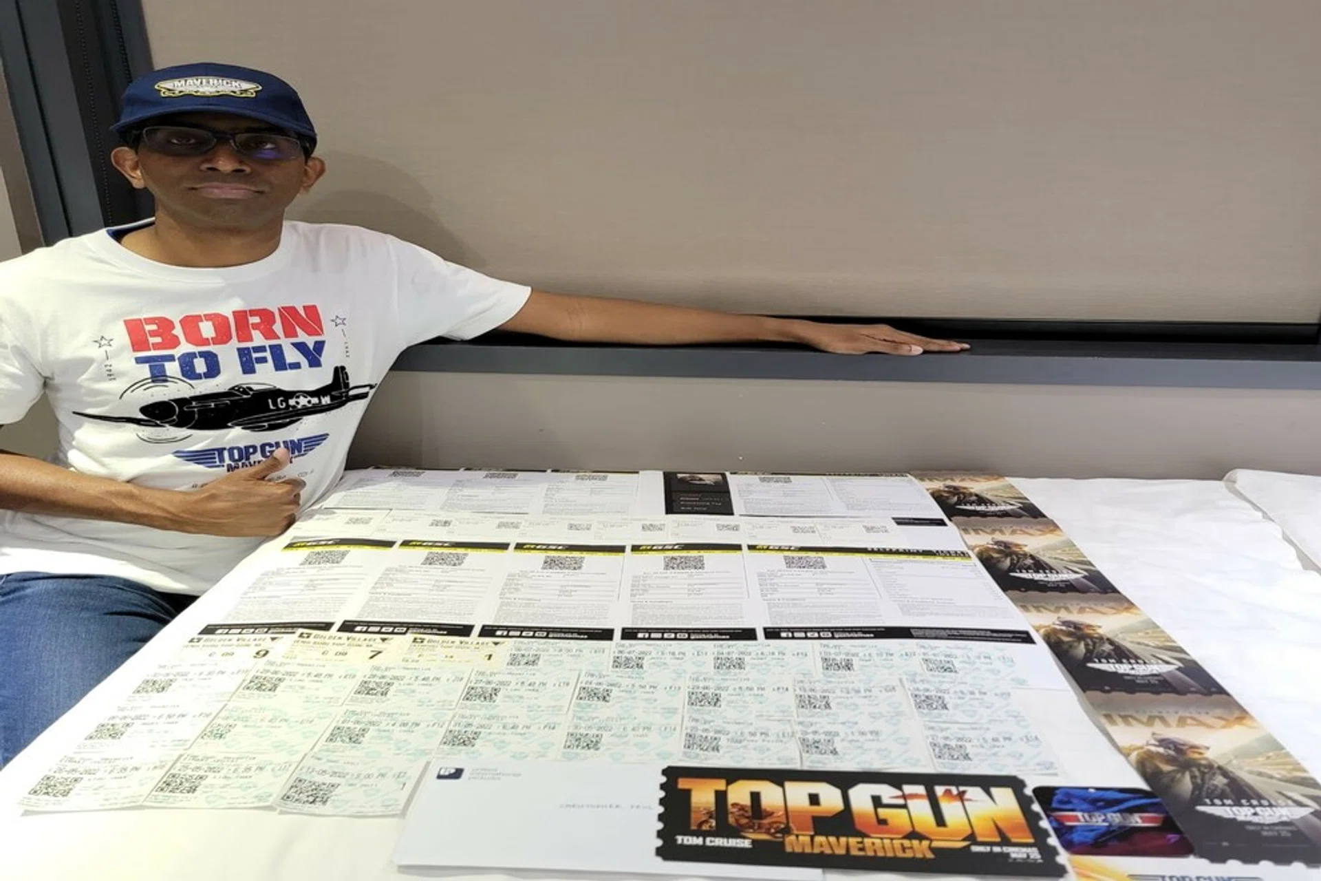 Mr Christopher Paul and his partial collection of ticket stubs. The self-professed cinephile first became enamored with the original Top Gun during his primary school days.