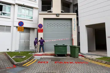 Cleaner dies in Punggol HDB trash compactor