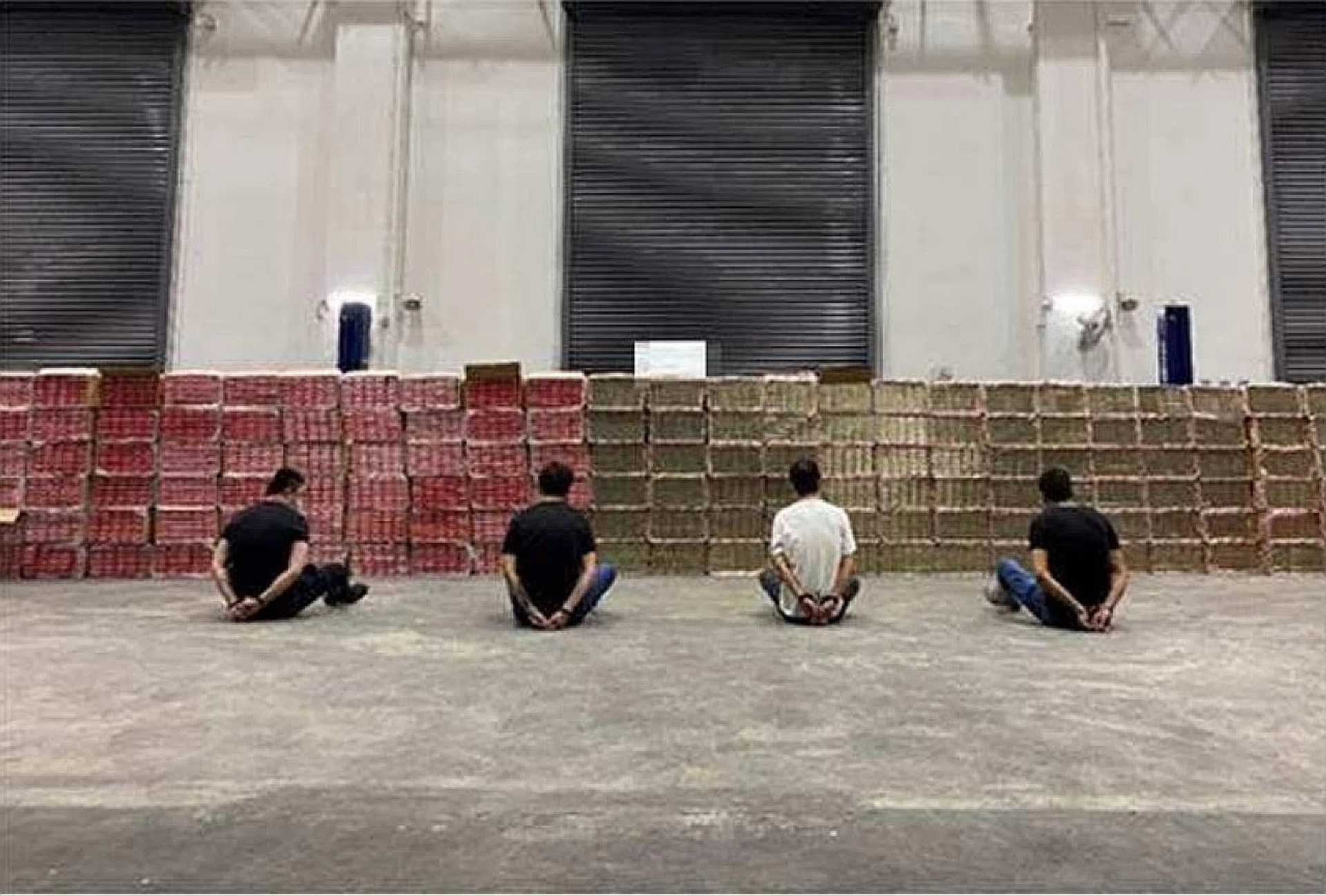 During the operation, officers saw a man using a forklift to remove metal cabinets from a container, while two other men were removing carton boxes containing duty-unpaid cigarettes from 16 metal cabinets. 