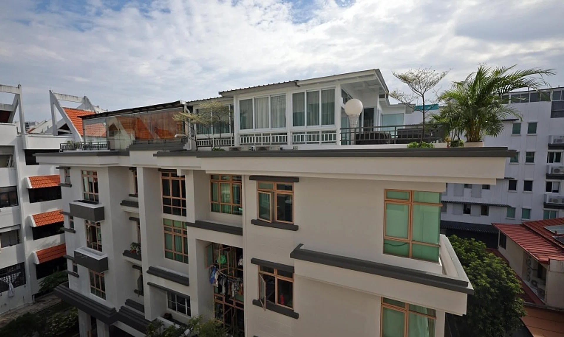 ST reported in September that BCA and URA said they were looking into possible unauthorised rooftop structures constructed at Rose Maison (above) and EiS Residences.